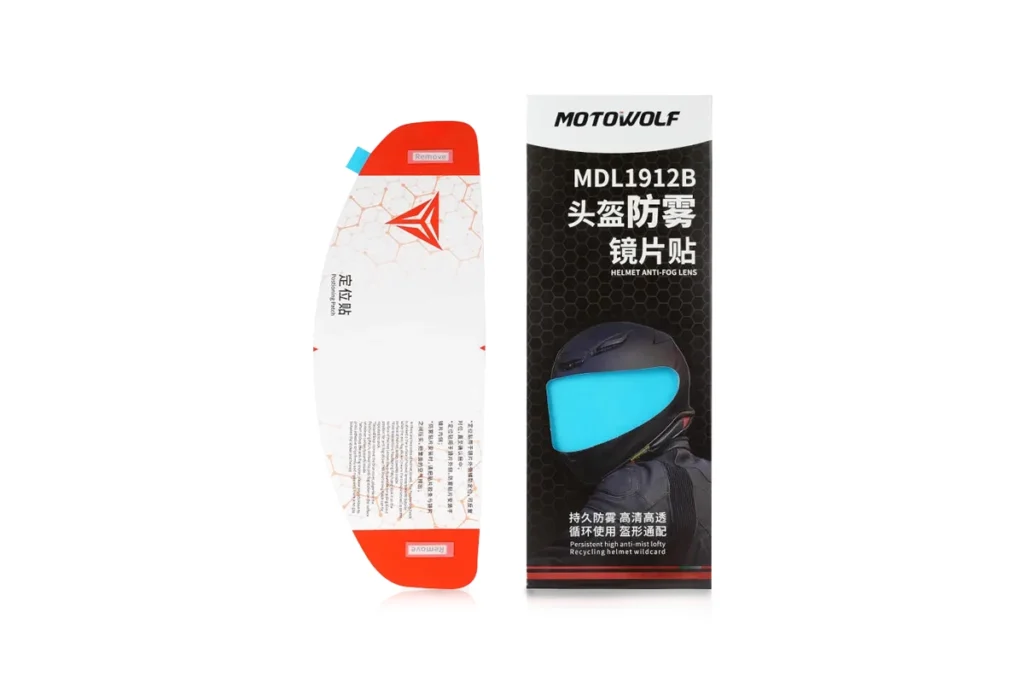 Clear Motowolf anti-fog sticker applied seamlessly inside a motorcycle helmet visor showing crystal-clear visibility