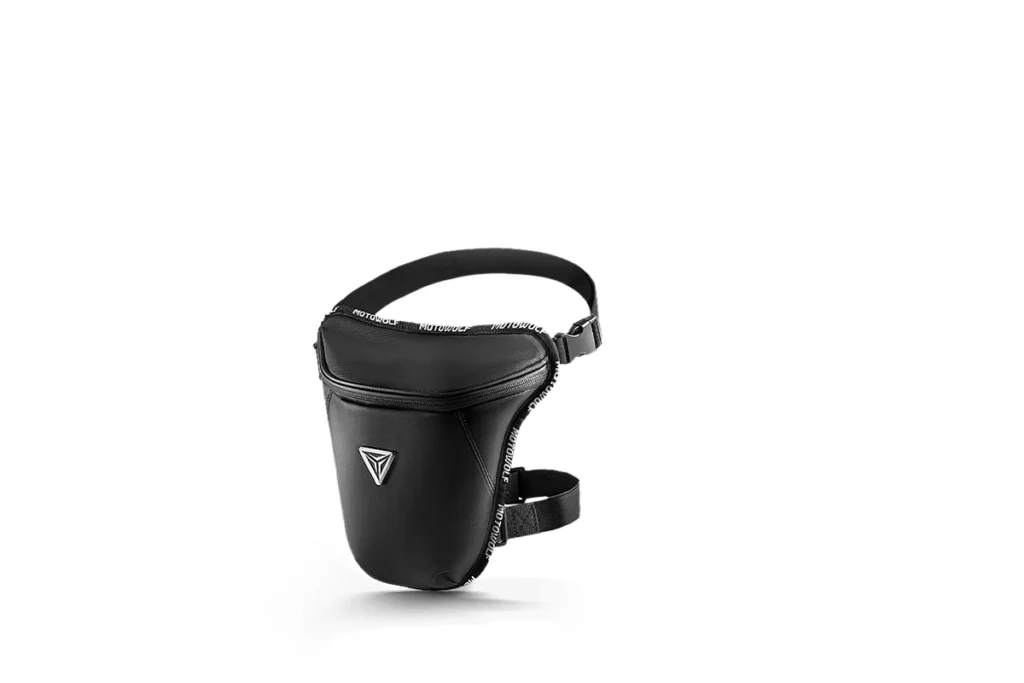 Black Motowolf Motorcycle Leg Bag securely strapped to a rider's thigh beside a street bike