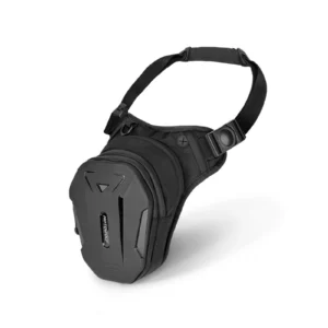 Black Motowolf Leg Bag strapped securely to a motorcycle rider's thigh beside a street bike