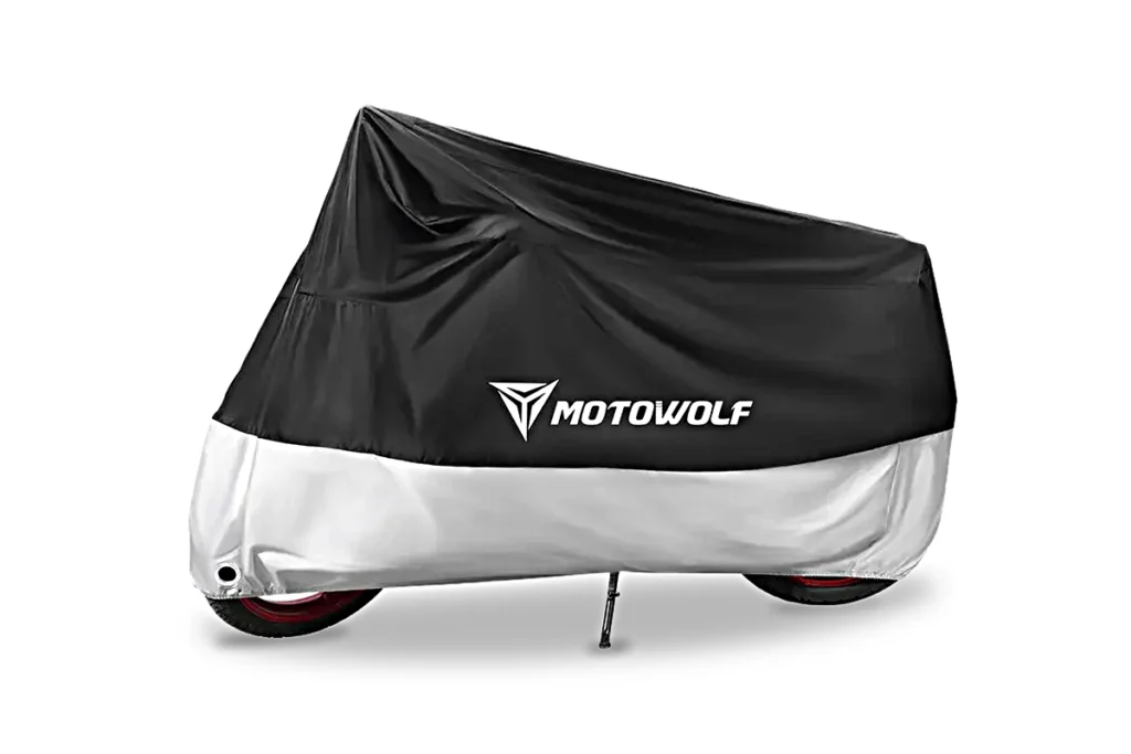 Black and silver Motowolf Waterproof Motorcycle Cover draped completely over a parked motorcycle outdoors