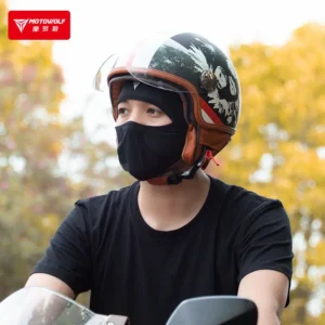 Motorcyclist wearing the Motowolf face mask smoothly underneath a full-face motorcycle helmet