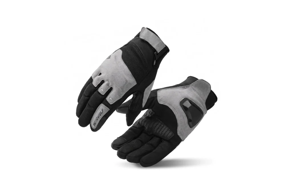 Pair of black Motowolf Synthetic Fiber Motorcycle Gloves displayed on a sleek motorcycle seat