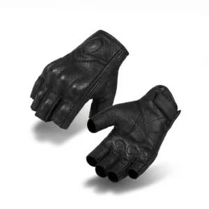 Pair of black Motowolf Genuine Leather Half Finger Gloves resting on a classic motorcycle gas tank