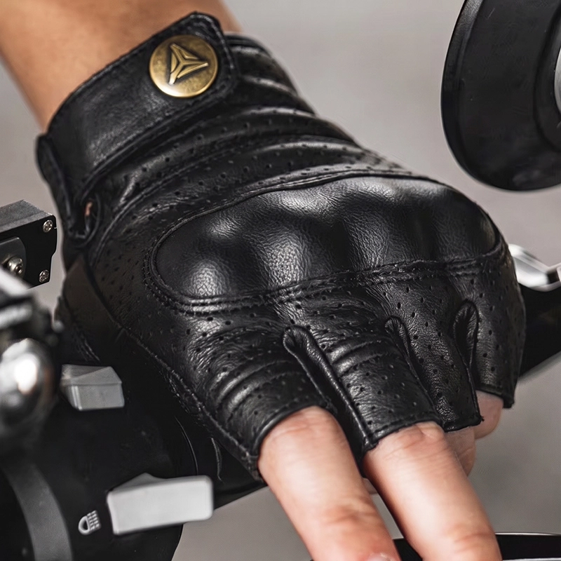 MOTOWOLF Leather Gloves – Retro Half Finger Motorcycle Riding Gloves 7 Rider's hand wearing the Motowolf Retro Half Finger Motorcycle Gloves adjusting a motorcycle helmet strap
