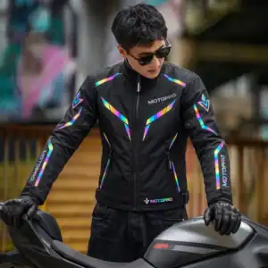 Motorcyclist standing next to a sportbike wearing the MotoPro Windbreaker during daytime