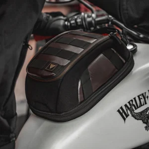 Rider carrying the Motowolf Retro Magnetic Tank Bag MB11 off the bike as a stylish vintage shoulder messenger bag