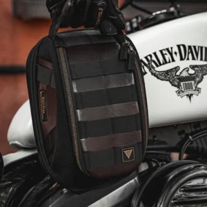 Water droplets beading and rolling off the exterior canvas of the Motowolf Retro Magnetic Tank Bag MB11